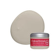 A jar of Colourtrend sample pot in front of a large, smooth, oval-shaped swatch of the neutral product on a white background.