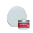 A jar of Colourtrend blue white paint shown in front of a large oval swatch of the pale minty cream product on a white background.