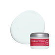 A jar of Colourtrend Infinite Colour cream makeup with a silver lid and red label, shown in front of a large oval swatch of the pale mint-green cream product on a white background.