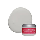 A jar of Colourtrend Infinite Colour Cream Ireland with a silver lid and red label, shown in front of a large, smooth, oval-shaped swatch of the cream-colored product on a white background.
